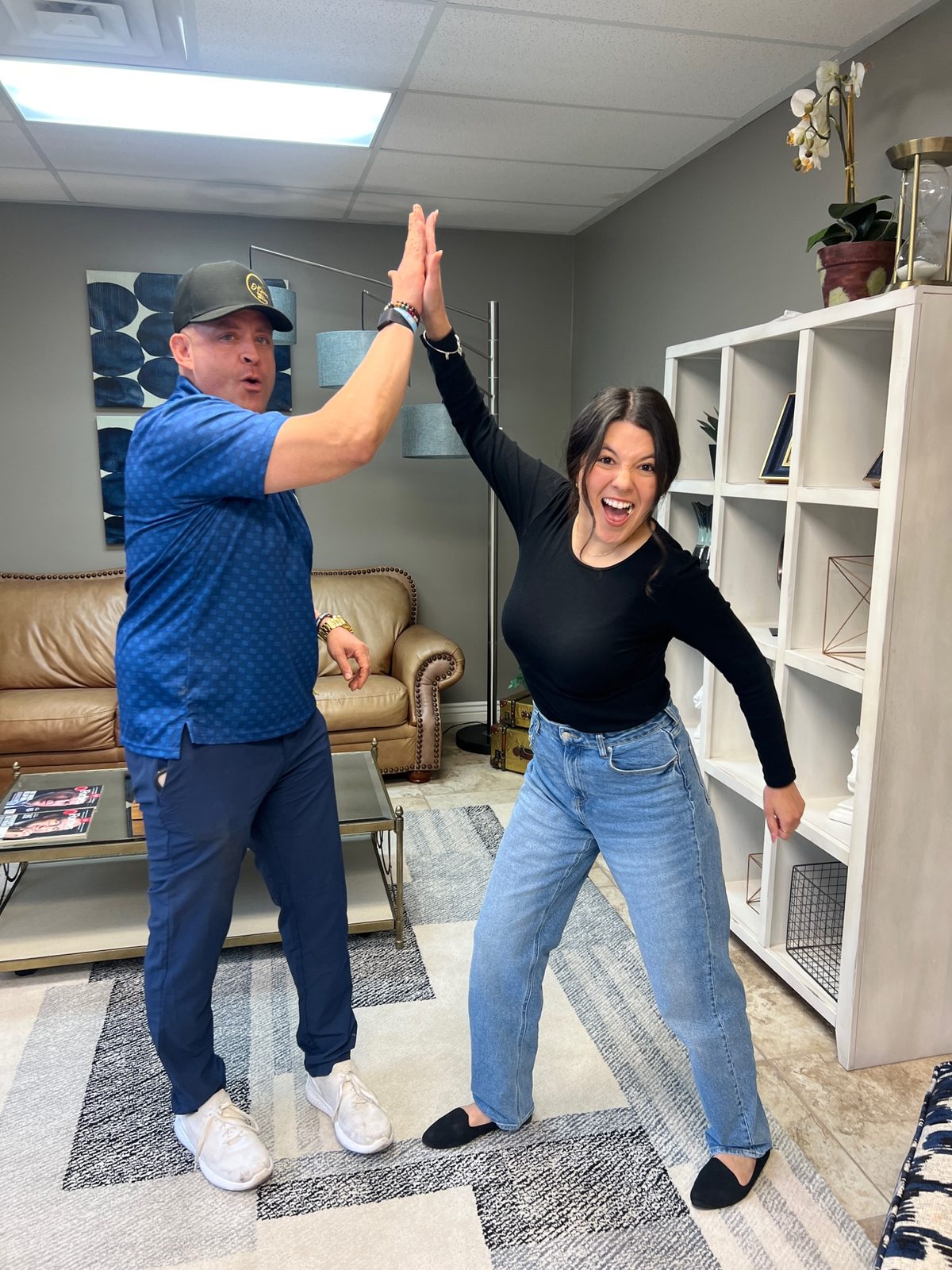 David high-fiving Linda after buying her first home